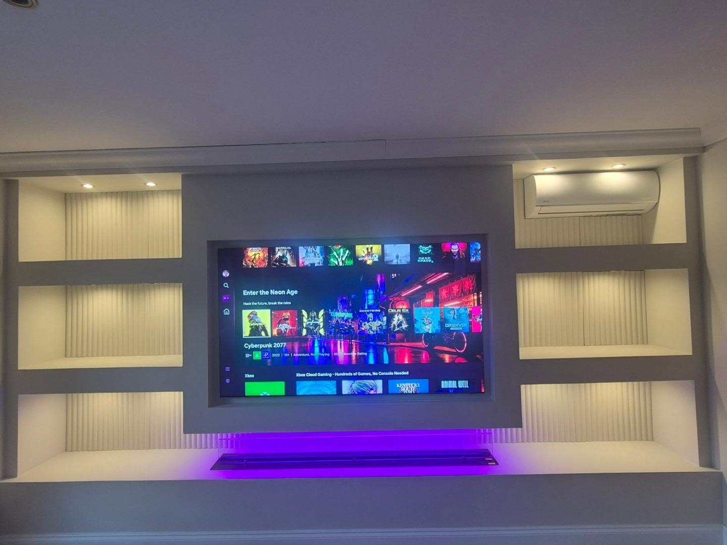 Built-in media wall with shelving and lighting